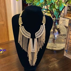 Gold toned, cleopatra style, fringed statement necklace.
